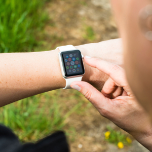 Ostfildern, Germany - April 26, 2015: A middle aged Caucasian woman is checking her Apple Watch displaying the main screen with numerous icons representing the various apps. The Apple Watch is the latest device by computer and smartphone manufacturer Apple Computer and is available since April 24, 2015.