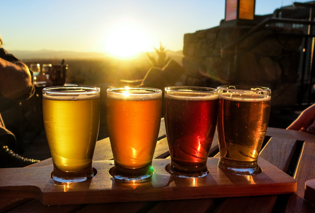 Colorful beer flight on a wooden table