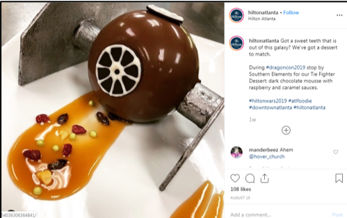 Social Media Post by the Hilton Atlanta showing their Star Wars-themed Tie Fighter dessert.